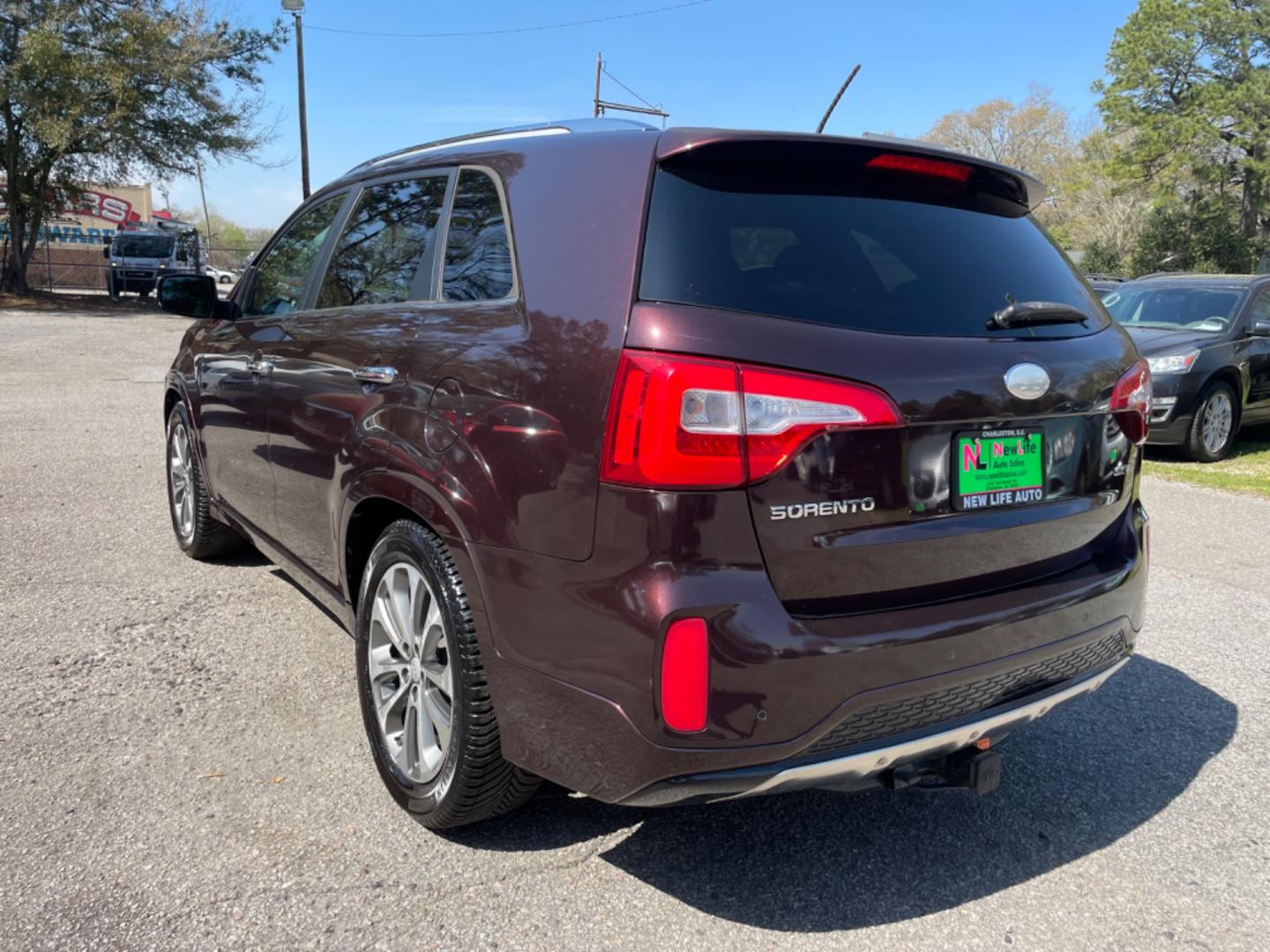 2015 PLUM KIA SORENTO SX (5XYKW4A77FG) with an 3.3L engine, Automatic transmission, located at 5103 Dorchester Rd., Charleston, SC, 29418-5607, (843) 767-1122, 36.245171, -115.228050 - Local Trade-in with Leather, Panoramic Sunroof, Navigation, Backup Camera, CD/AUX/Sat/Bluetooth, Dual Climate Control, Power Everything (windows, locks, seats, mirrors), Heated/Cooled/Memory Seating, Power Liftgate, Convenient Third Row, Push Button Start, Keyless Entry, Alloy Wheels. Certified One - Photo#4